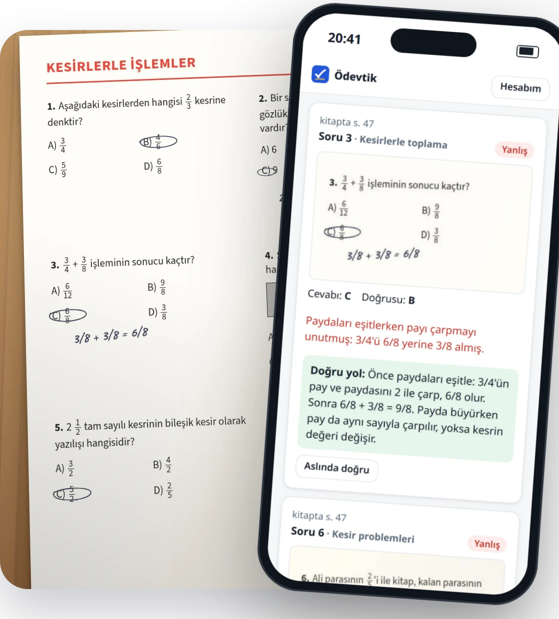 Masadaki ödev sayfasının üstünde, yanlış soruyu ve doğru yolu gösteren telefon ekranı